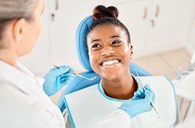 Happy patient smiling up at dentist