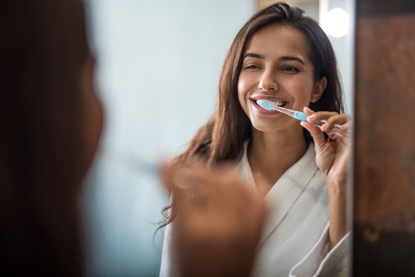 using kitchen sink brushing teeth