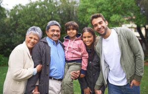 Three generations of family posing for a portrait